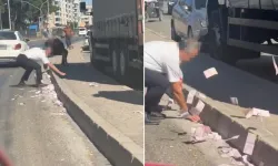 Trafikte çuval dolusu para yola saçıldı